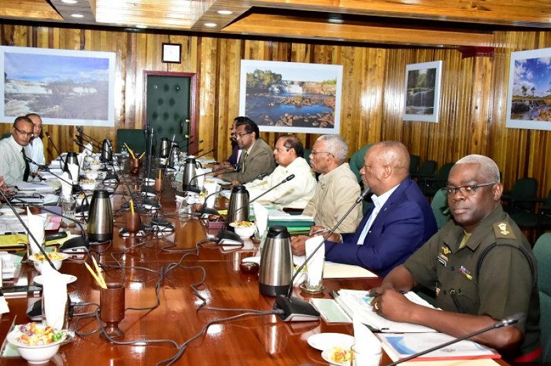 President David Granger sits alongside Prime Minister ,Moses Nagamootoo, Minister of Public Security , Khemraj Ramjattan ,  Minister of State , Joseph Harmon , Attorney General Basil Williams (partly hidden) and a member of the security services.