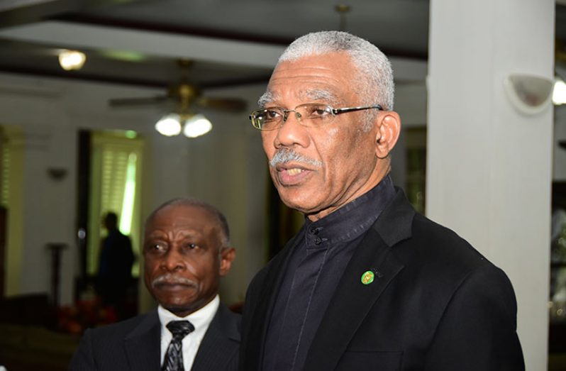 President David Granger speaking to reporters as Foreign Affairs Minister, Carl Greenidge, looks on (Adrian Narine photo)