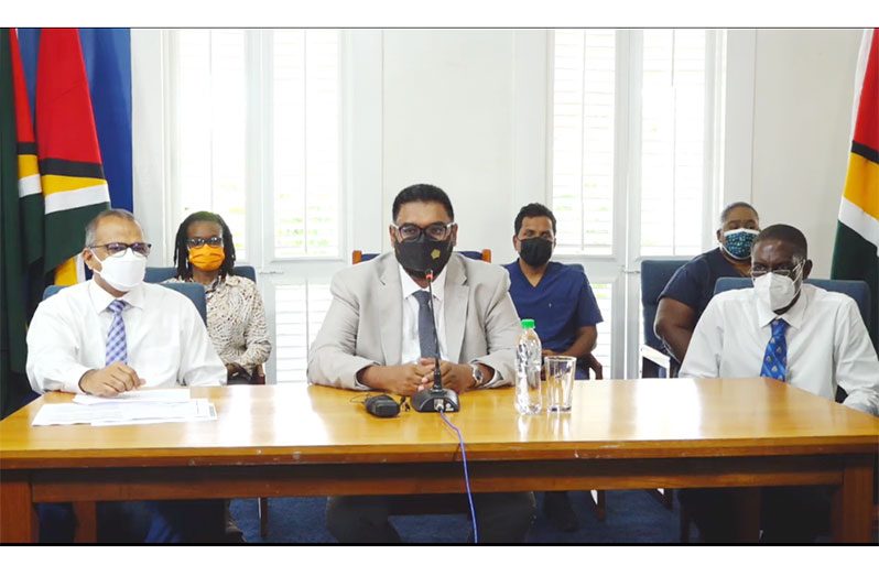 President, Dr. Irfaan Ali (centre) with Minister of Health, Dr. Frank Anthony (front left); Director of Medical and Professional Services at the Georgetown Public Hospital Corporation (GPHC), Dr. Fawcett Jeffery (front right); head doctor at the Infectious Disease Hospital, Dr. Tracey Bovell (back right); National Emergency Medical Director, Dr. Zulfikar Bux (back centre) and Director of Primary Health Care Services, Dr. Ertenisa Hamilton, during the emergency media briefing on the country’s COVID-19 situation, on Wednesday