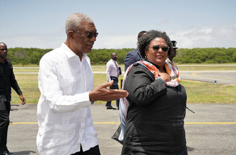 President David Granger with Barbados Prime Minister Mia Mottley, OR, on her arrival at the Eugene F. Correia International Airport on March 11