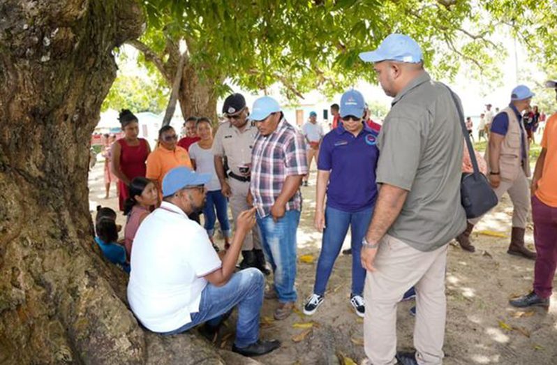 President, Dr Irfaan Ali interacts with residents of Shea village (DPI photo)