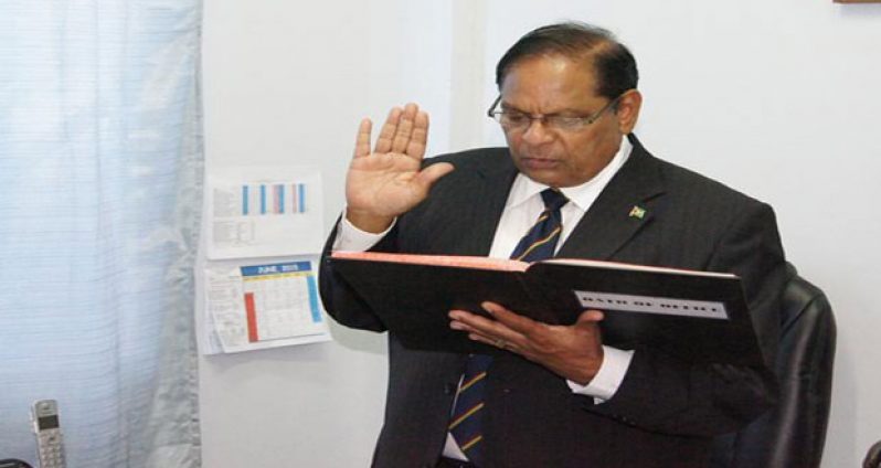 Prime Minister Moses Nagamootoo taking the oath as President. President David Granger left Guyana yesterday to attend the CARICOM Heads of Government Conference in Barbados.