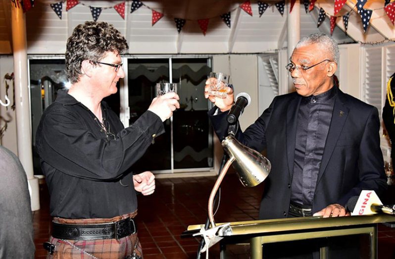 President David Granger and British High Commissioner to Guyana, Mr. Greg Quinn, toast to the long-standing relationship between Guyana and Britain