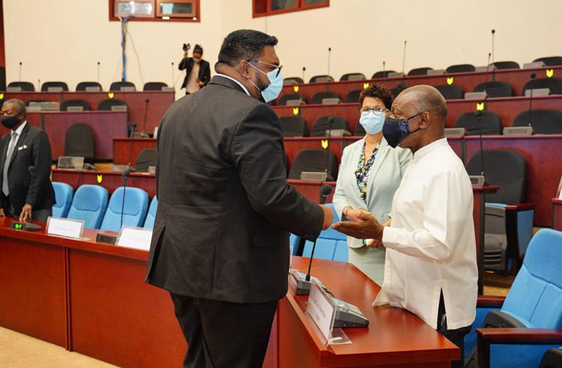 President, Dr. Irfaan Ali and former APNU+AFC Minister of Foreign Affairs, Mr. Carl Greenidge interact at the Arthur Chung Convention Centre after the historic ruling by the ICJ on Friday (OP photo)
