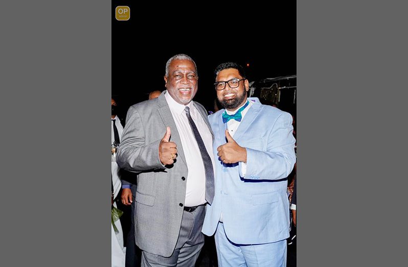 President Dr Irfaan Ali and Prime Minister Brigadier (retired) Mark Phillips posing for a photograph at the Guyana Defence Force Officers' Club cocktail reception and fireworks display at Base Camp Ayanganna, while ushering in the new year (Office of the President photo)