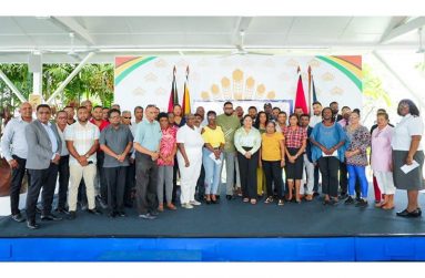 President Dr. Irfaan Ali stands with members of the private sector commission and officials of the sixteen Charities that were beneficiaries of the Cricket for Charity’ game during The Kares One Guyana T10 Tapeball Blast