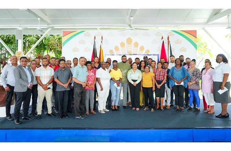 President Dr. Irfaan Ali stands with members of the private sector commission and officials of the sixteen Charities that were beneficiaries of the Cricket for Charity’ game during The Kares One Guyana T10 Tapeball Blast