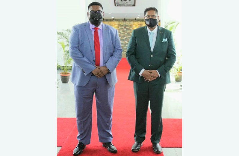 President Dr Irfaan Ali (L) and Suriname's Head-of-State, Chandrikapersad Santokhi