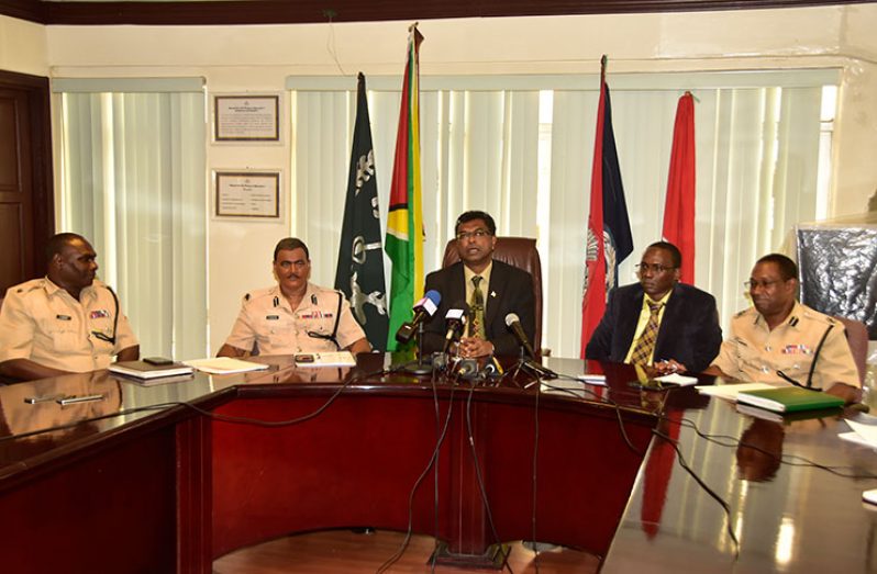 Minister of Public Security, Khemraj Ramjattan (centre), makes a point as Acting  Commissioner of Police, David Ramnarine (second left), Traffic Chief Dion Moore (left), Acting Crime Chief Paul Williams (second right) and Assistant Police Commissioner Clifton Hicken (right) look on Monday (Photo by Adrian Narine)