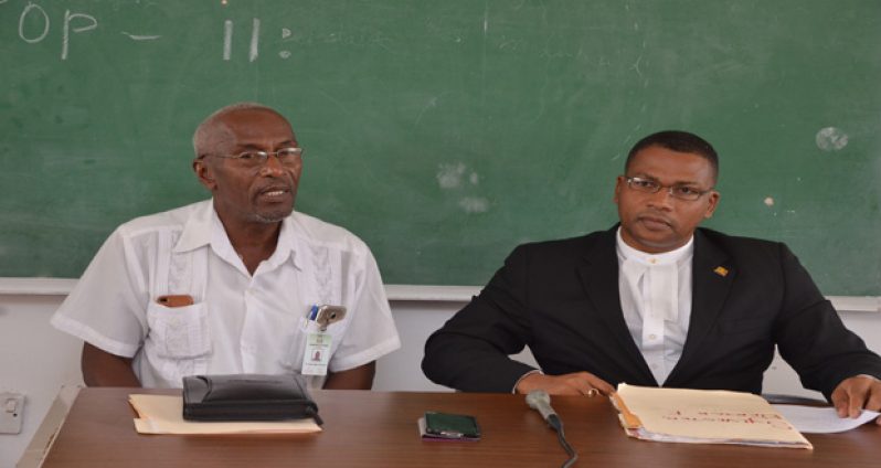 Attorney-at-Law Derick Fields Sylvester and University of Guyana Registrar, Dr Nigel Gravesande
