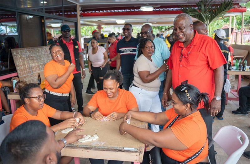 Prime Minister Brigadier retired Mark Phillips watches the competition in the Prime Minister’s Independence Dominoes Tournament