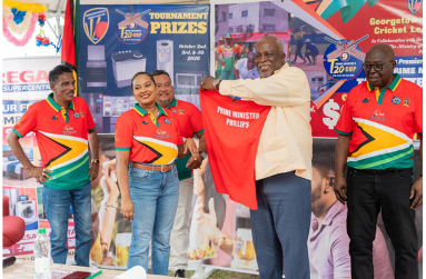 Prime Minister Mark Phillips, second from right, with his tournament shirt. Others in picture, from left, are Inderjeet Persaud, GSCL Secretary Telesha Ousman, Vice-president John Ramsingh and President Ian John