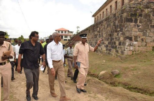 President David Granger and Public Security Minister Khemraj Ramjattan and prison officials during their tour of the Mazaruni Penal Settlement last year (File Photo)