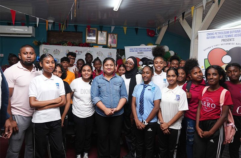 Minister of Education, Priya Manickchand, stands with some of the students following the launch of the Guyana Table Tennis Association Nationwide National Schools’ Table Tennis Championship.