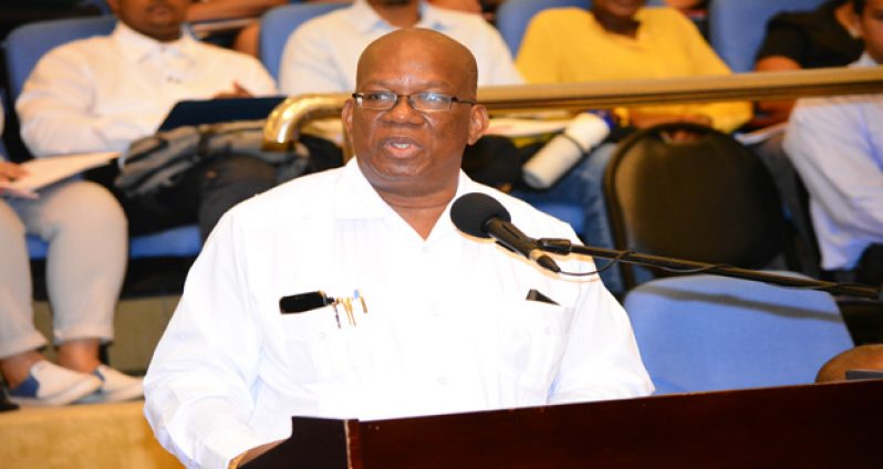 Finance Minister, Winston Jordan delivering remarks during the 2015 Procurement Symposium