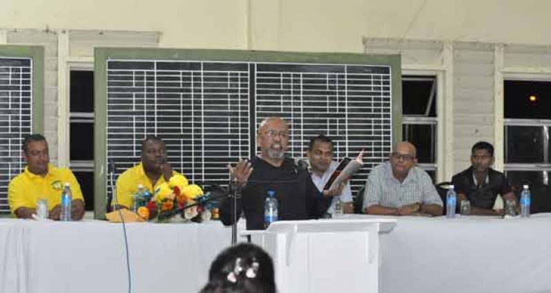 Here is how the Everest Cricket Club began. Professor Clem Seecharan (at podium regales his audience on how the Everest Cricket Club was founded, while at the head table from second left, Rajesh Singh, Stephen Lewis, Dr Frank Anthony, Tota Mangar and Shivnarine Chanderpaul pay keen attention.