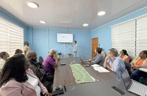 Minister of Public Works, Bishop Juan Edghill and other officials receiving an updated progress briefing on the high-profile Linden-Mabura Road Project