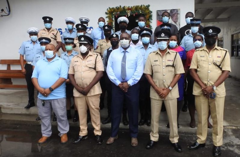 Second from left at front: Commander Errol Watts with other senior ranks and the newly-promoted subordinate officers