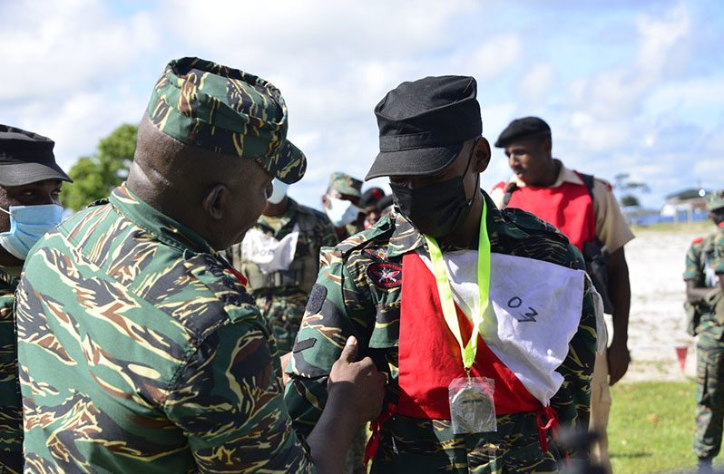 Brigadier Bess affixes the new badge of rank on LCPL Nicholson (Photo: GDF)