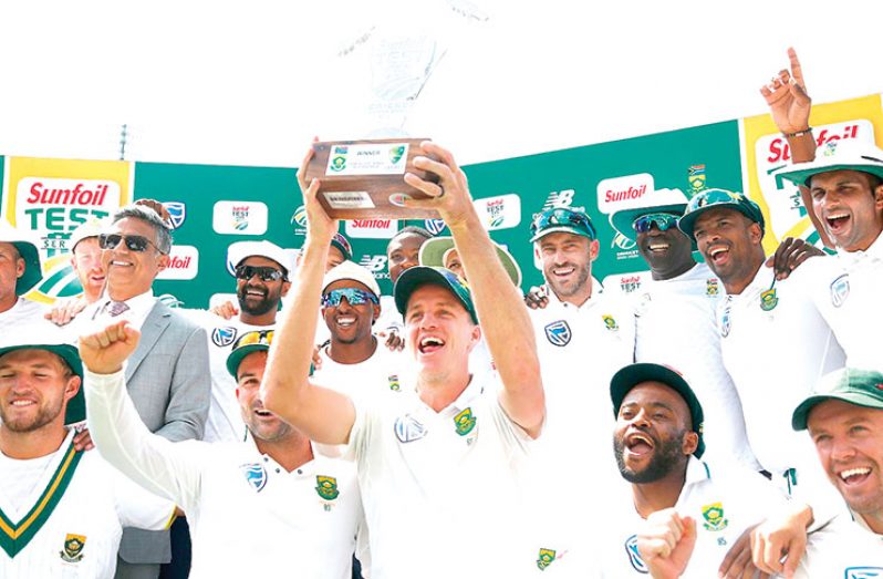 South Africa's Morne Morkel celebrates with the trophy and team mates after winning the series against Australia. (Photo AFP)
