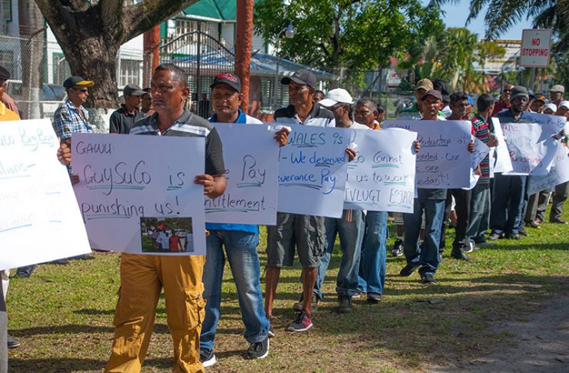 Sugar workers protesting outside the Ministry of the Presidency (Delano Williams photo]