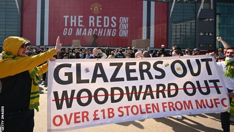 Supporters protest against Manchester United's owners outside Old Trafford.
