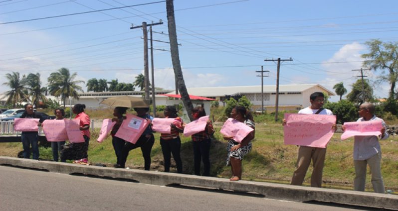 Members of Red Thread Guyana during their Friday protest on Lamaha Street, opposite the Ministry of Social Protection building