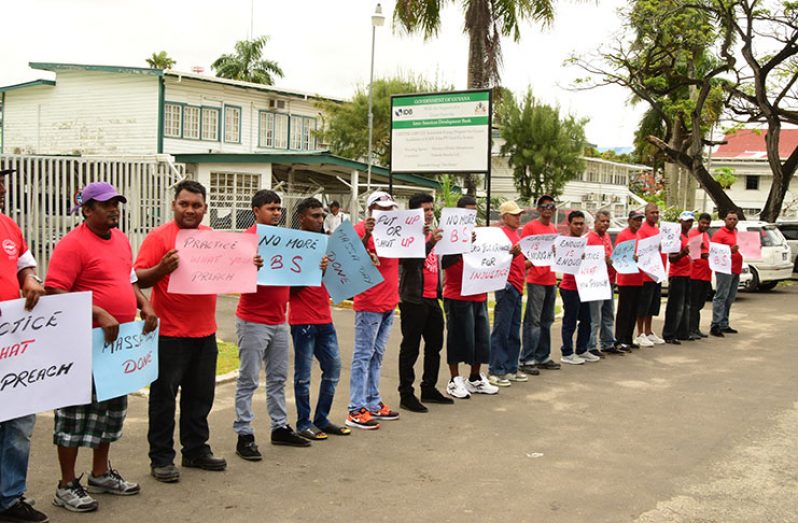 Workers of the East Demerara Water Conversancy (EDWC) on the picket line on Thursday (Adrian Narine photo)