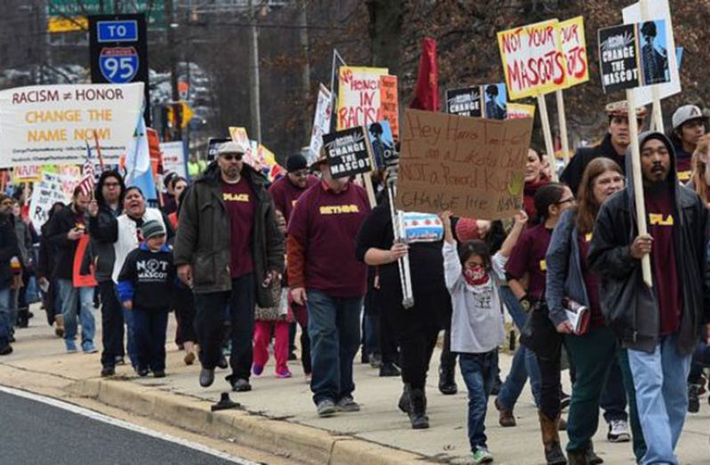 Native Americans and supporters protesting against Redskins' name and logo