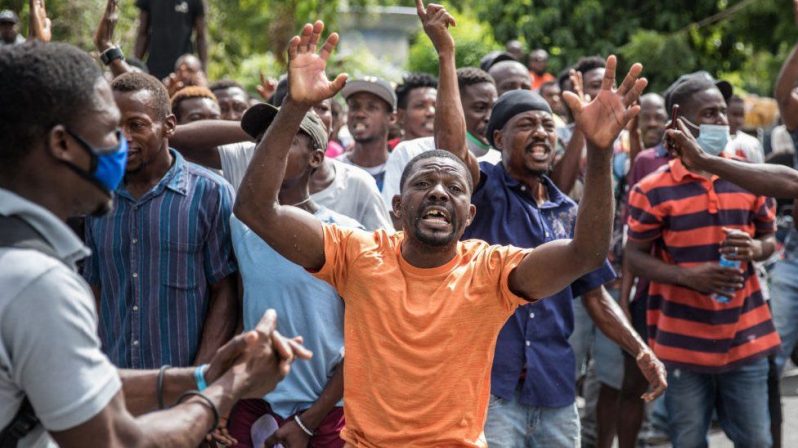 Large crowds surrounded the Pétion-Ville Police Station in Port-au-Prince, where the men have been detained (BBC photo