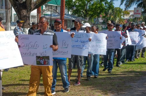 Sugar workers protesting outside the Ministry of the Presidency. [Delano Williams Photo]