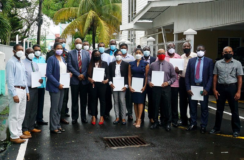 Minister of Public works, Juan Edghill (fourth from left) with the members of the newly-installed Sea and River Defence Board. (Elvin Croker Photo)