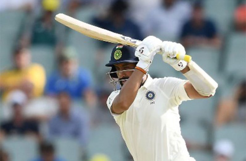Cheteshwar Pujara hits century on opening day.