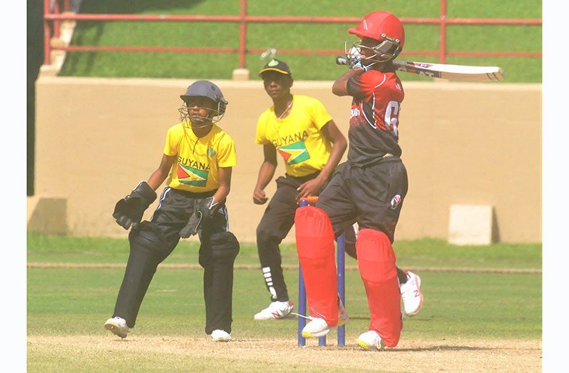 Mikel Ali pulls for four during his shot-filled 37 at Guyana National Stadium, Providence yesterday. (Sean Devers photo)