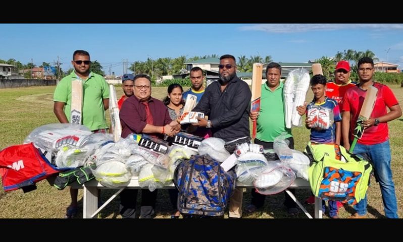 GCB president Bissoondyal Singh hands over gear donation to EBCA president Puneet Jaigopaul