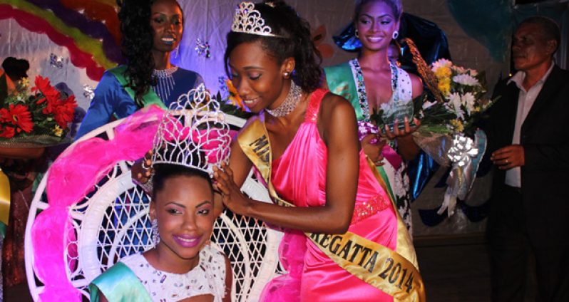 Eighteen-year-old Kimberly Paul being crowned Miss Regatta 2016 by the 2014 Queen