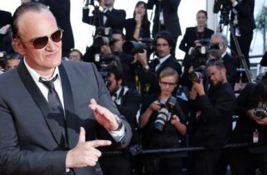 Director Quentin Tarantino poses on the red carpet as he arrives at the closing ceremony of the 67th Cannes Film Festival in Cannes May 24, 2014.