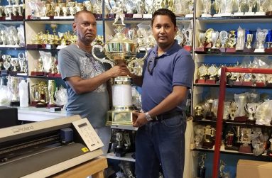 From left are Ramesh Sunich proprietor of Trophy Stall and Mr Vicky Bharosay, former treasurer of the UCCA and BCB, at the simple launching of the tournament last Saturday at Trophy Stall new branch at Port Mourant, Berbice.