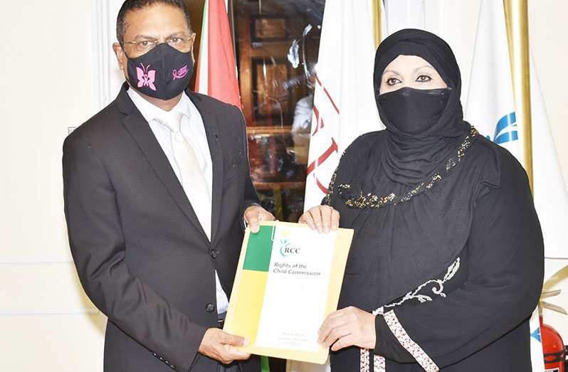 Speaker of the National Assembly, Manzoor Nadir, receiving the Rights of the Child Commission reports for 2017 and 2018 from RCC Chairperson, Aleema Nasir (Elvin Croker photo)