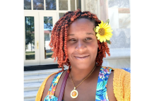 : Melania Desa, creative enthusiast and founder of Cactus Black Sheep and Fiestaville, with plaited braids and a sunflower in her hair (Photo credit: Melania Desa)