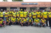 The Regal All-Stars and Masters teams pose for a photo after they arrived yesterday for the Florida Cup softball tournament.
