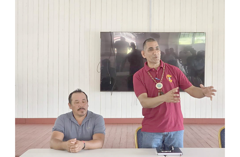 Regional Executive Officer Deolall Rooplall (right)