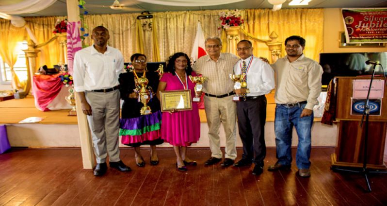 The Awardees pose with Education Minister Dr Rupert Roopnarine, Director of Sport Christopher Jones and Ansa McAl Berbice Regional Manager Mark Bhikhai after the event.