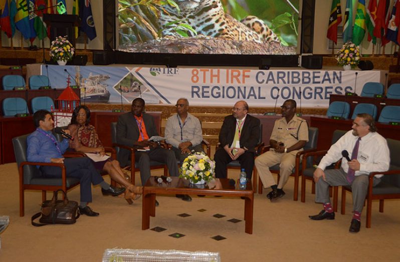 Seated at the panel discussion on Road Safety Risk are: Project Coordinator of the Ministry of Public Infrastructure's Traffic and Safety Maintenance Department, Kester Hinds (third left), and Guyana Police Force (GPF) Traffic Chief, Linden Isles (sixth left), along with other experts in the Region (Adrian Narine photo)