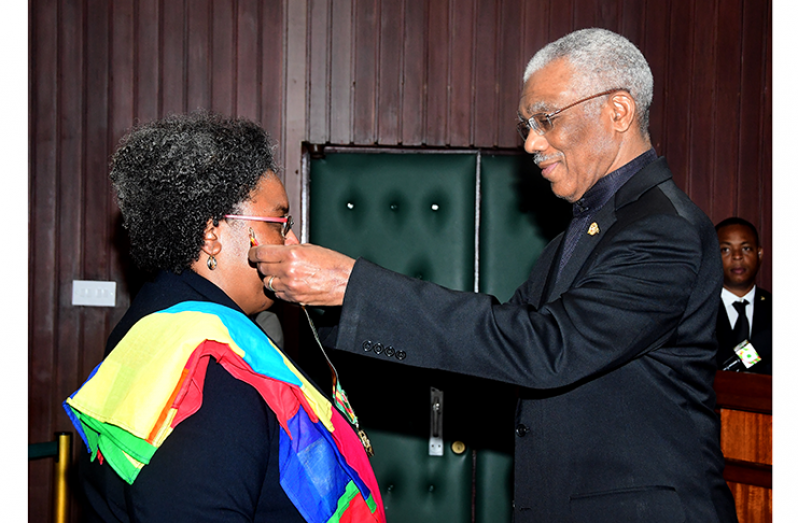 President David Granger conferring the Order of Roraima on Barbados Prime Minister Mia Mottley, O.R., Q.C., M.P.