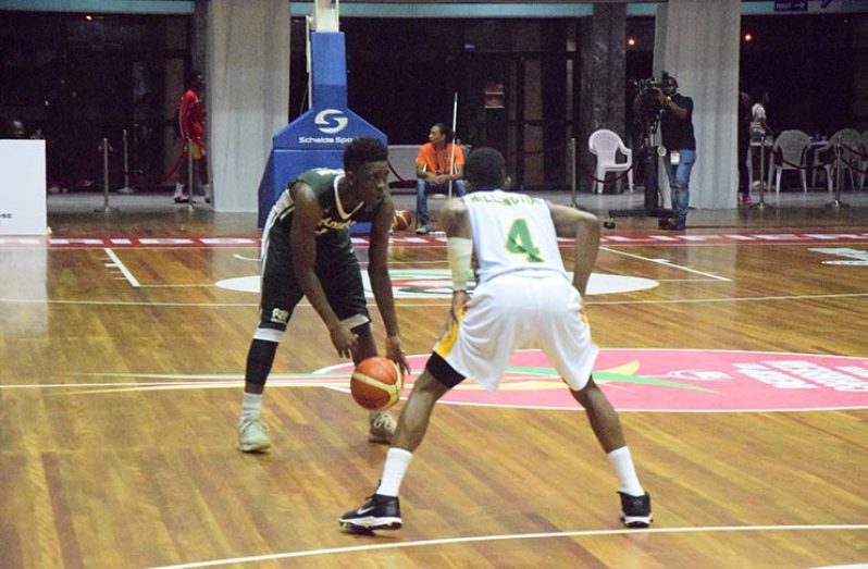 Stanton Rose being guarded by St Vincent and the Grenadines’ Reinaldo Millington during his game-high 41 points performance at the CBC Championships. (Photo compliments--Kaieteur News)
