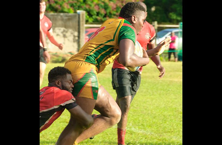 Guyana’s Vallon Adams powering his way against Trinidad and Tobago in the RAN South Zone Finals (Delano Williams Photo)