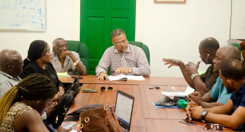 Chief Labour Officer, Charles Ogle, (centre) meets with representatives from the Guyana Bauxite and General Workers Union (Delano Williams photo)