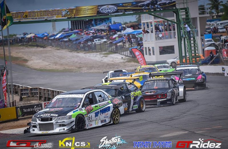 FLASHBACK! Kristian Jeffrey leads Roger Mayers of Barbados into the first corner during last year’s CMRC event in Guyana. (GTRIdez photo)