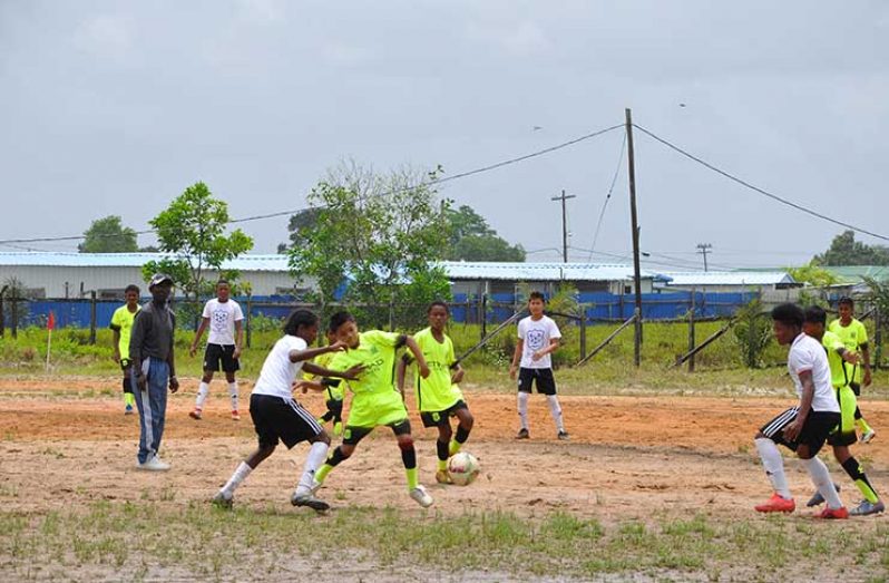Herstelling Raiders and Kuru Kururu Warriors battling it out yesterday at the Timehri Red Ground